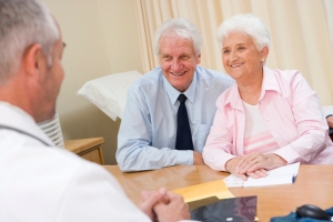 Couple in doctor's office smiling